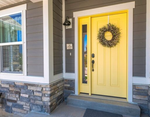 Panorama,Yellow,Front,Door,With,Wreath,And,Sidelight,At,The